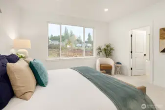 Secluded on the second floor is the expansive primary bedroom, complete with a walk-in closet and a spa-like bathroom suite.