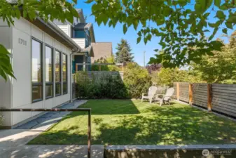Fully fenced in front yard offers lots of privacy