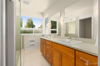 Primary bathroom with great storage space & dual sinks
