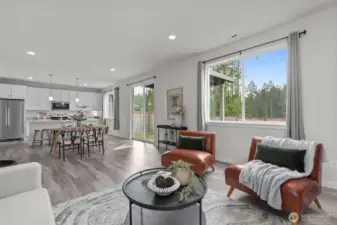 Large open living and dining room. Oversized windows and tall ceilings add for ample natural light.
