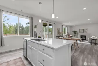 Lovely white quartz counter with ample, deep counter space.