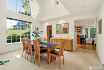 Opens to the kitchen, Poweder, room and main floor bedroom