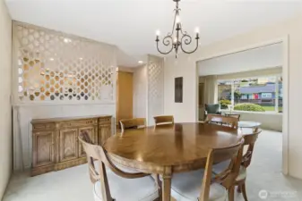 Separate dining room connecting seamlessly to the living room and kitchen