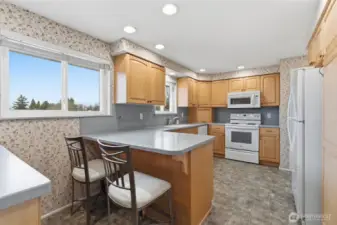 Convenient eat-in kitchen area with space for two barstools