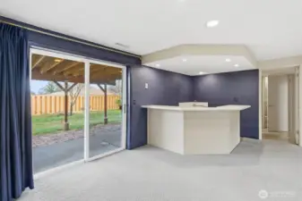 Lower level offers bar area and huge recreation room and it leads to patio and backyard