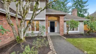 Elegant archway greets visitors. Large 10,400 SQFT Lot, fully-fenced level yard.