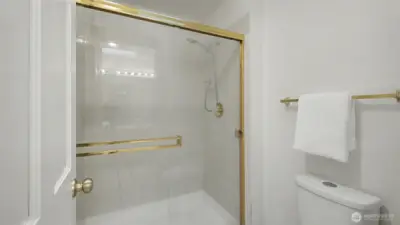 Large glass framed shower in the primary bath.