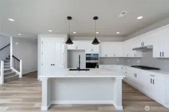 Photos are of another home in the community and are for illustration purposes only to reflect typical finishes.  May depict seller enhancements.  Colors and options may vary.