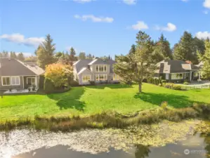REAR VIEW - House in the middle - Wow...!!! Overlooks the pond and fairway!!!