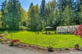 Charming gardens and greenhouse.