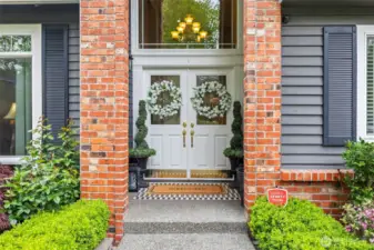 The double door entry is majestic and covered.