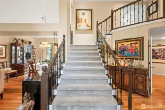 This grand stair case is open, inviting and twice the width of most staircases.