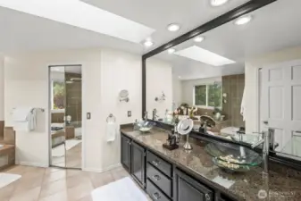 The primary en-suite is tranquil and spa like.