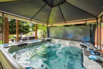 Enjoy the hot tub protected by the 10x10 gazebo.