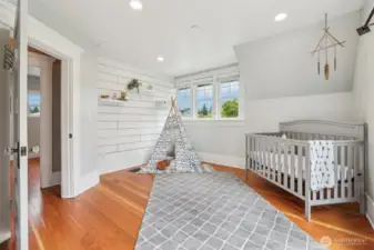 Upstairs Bedroom. Shiplap wall, and a small built in study desk