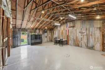 Corrugated steel on the back wall maintains the farmhouse charm. Refrigeration unit – negotiable.