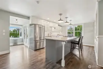 Updated kitchen – concrete counters + plenty of white cabinetry