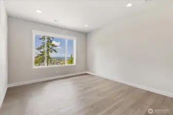 Office/Bonus Room features wonderful valley views.  Automated shades in this room as well!  Current owner uses this as an office (for listing purposes, personal belongings have been digitally removed).