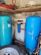 Inside pump house with a water filter.