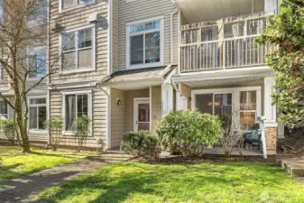 A lush green lawn greets you as you arrive home, offering a vibrant and inviting atmosphere.