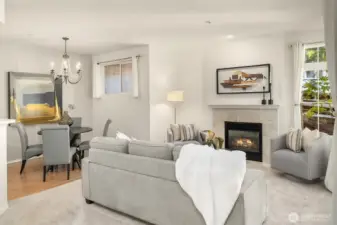 The living room boasts a cozy gas fireplace with a tile surround, perfect for chilly evenings, creating a welcoming atmosphere for relaxation and entertaining.