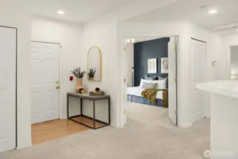 Walk through the double doors into the inviting 2nd bedroom, featuring an accent wall and a ceiling fan for added comfort. This space is perfect for guests or as a cozy retreat.