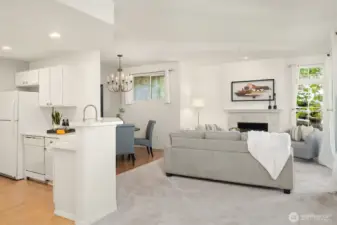 The open layout seamlessly connects the kitchen to the dining and living room, making it perfect for entertaining. The space feels spacious and inviting, with plenty of natural light streaming in.