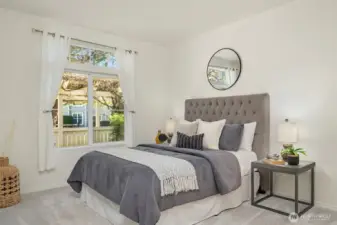 The primary suite boasts an abundance of natural light, creating a bright and airy atmosphere.