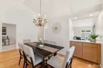 Formal dining room open to living room with convenient cocktail pass-through