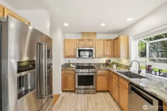 Updated kitchen with granite countertops.