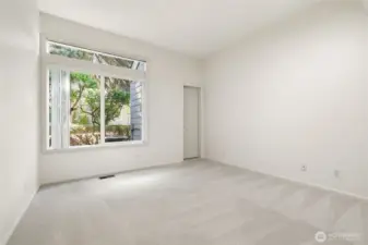 Second Guest Bedroom: New carpet and wall paint, Conveniently located across from guest bathroom, Walk-in closet, Transom window for added natural light