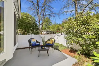 Garden Patio: Updated smooth, painted concrete patio, Newer vinyl fence, perfect for your morning coffee