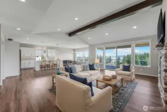 Enjoy the open concept living space with vaulted ceilings, gourmet kitchen, huge great room and dining room that all open to the expansive deck with the views as your backdrop from every corner.  Virtually staged.