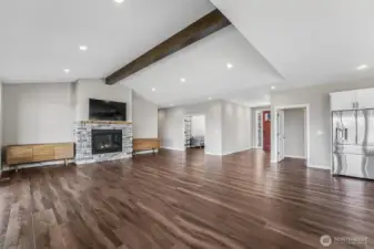 Vaulted ceilings with beam accents are just one of the many luxuries of this property.