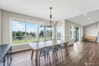 A meal with a view in this gorgeous dining room. Also access outside directly from this space.