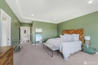 The spacious primary bedroom has deck access and a luxury ensuite.