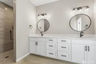 The luxurious primary bathroom features double sinks and an amazing shower.