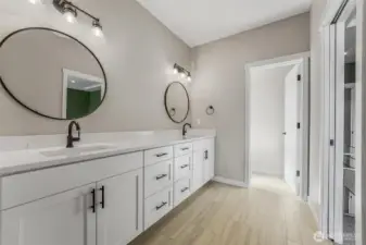 Luxury meets functionality in the primary bedroom’s ensuite.