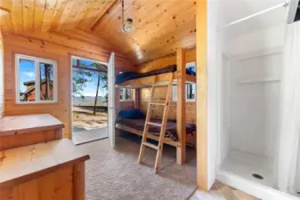 Shower house is finished with cedar wood walls and ceiling. Endless hot water heater. Wired for propane light system.