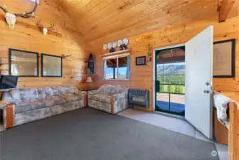 Cabin great room is warmed with propane wall heat and or freestanding woodstove.