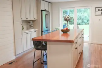 Kitchen with large island with eating space