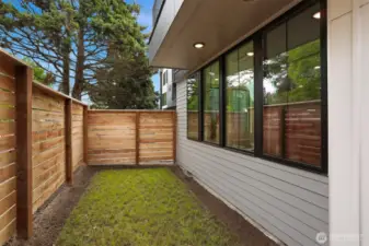 Fenced Yard Space and Mechanical Room with Storage