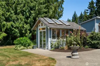 Beautifully maintained main residence with lush landscaping and mature trees.
