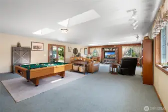 Expansive flex space perfect for gatherings, games, or media.