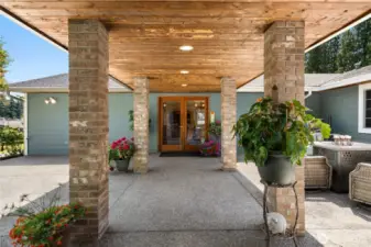 Spacious covered patio for relaxing or entertaining, with peaceful outdoor vibes.