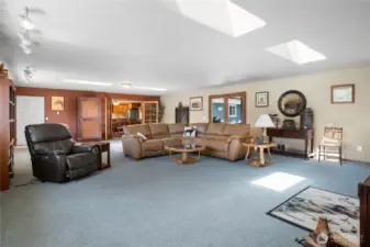 Bright living room with vaulted ceilings and ample natural light