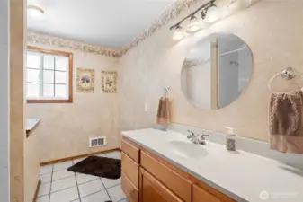 Spacious bathroom with large tub and separate shower.