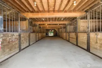 13-stall barn with wide central aisle, water to each stall, and excellent airflow.