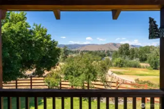 Stunning river and mountain views off the covered deck over looking the riding arena