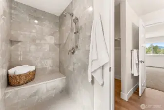 Luxury real stone tiled walk-in shower in Primary En-suite.